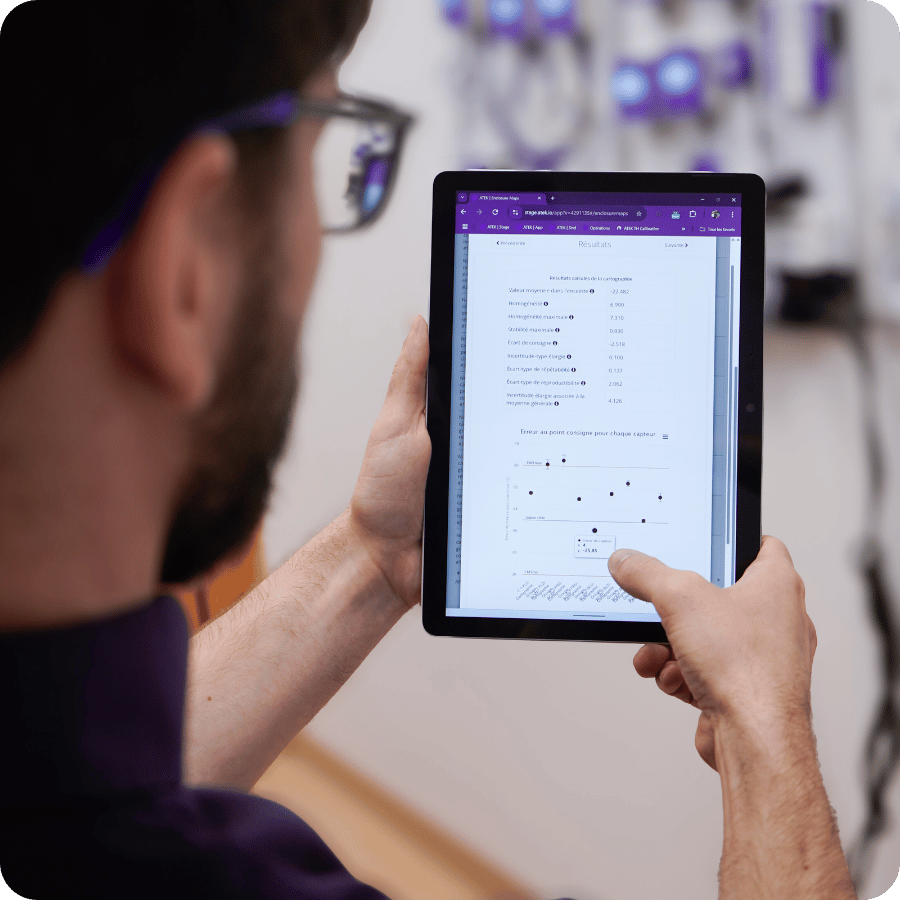 An ATEK technician mapping the temperature distribution in a scientific freezer.