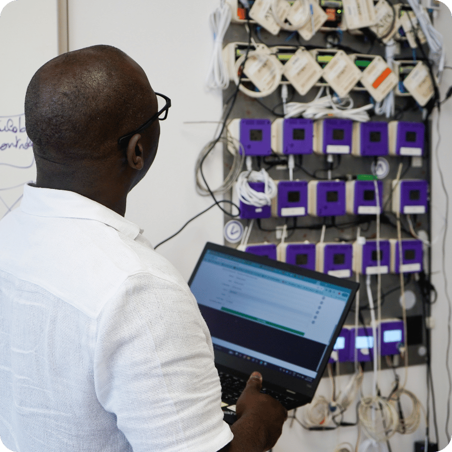 Technician checking environmental monitoring sensors, representing ATEK's innovation in data management solutions.