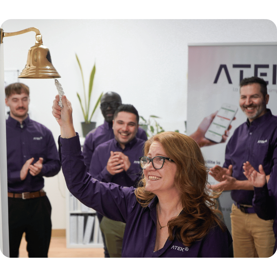 ATEK team smiling, celebrating company successes and collective achievements.